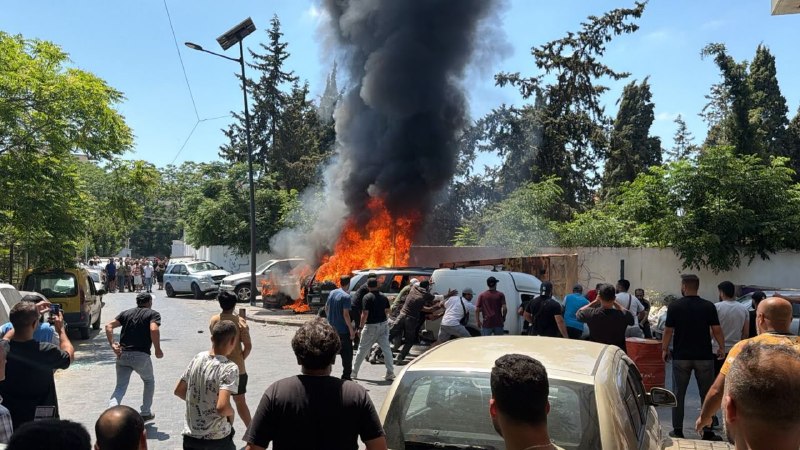 A vehicle ablaze in the Sidon area after a reported Israeli drone strike on 10 June 2026, according to Lebanese sources cited by al-Alam.