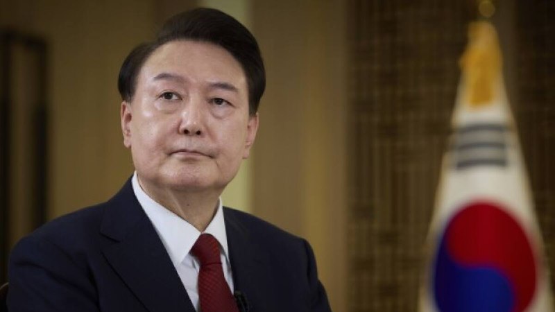 Former South Korean President Yoon Suk Yeol escorted into the Seoul court that sentenced him to 30 years on 12 June 2026.